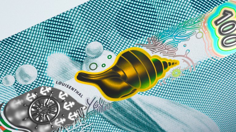 Close-up of a banknote with RollingStar® LEAD security film in the shape of a shell