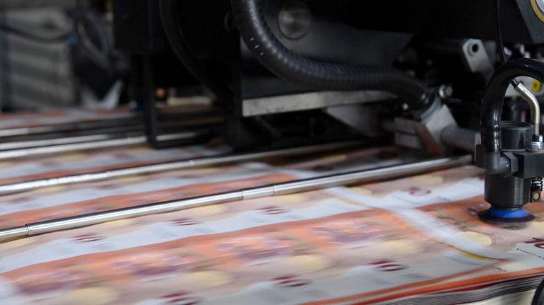 Close-up of a machine producing the 10 euro banknote