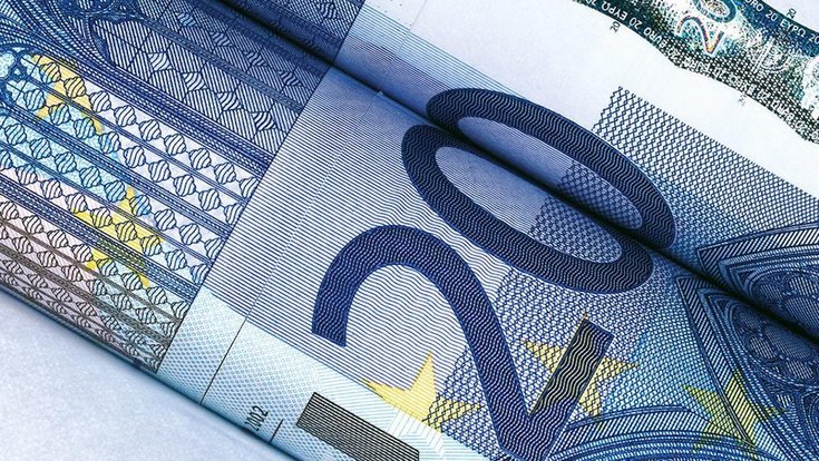Close up of two rolled up 20€ bills