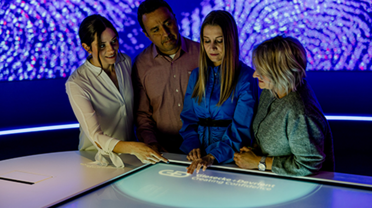 Team discussing in a futuristic office setting