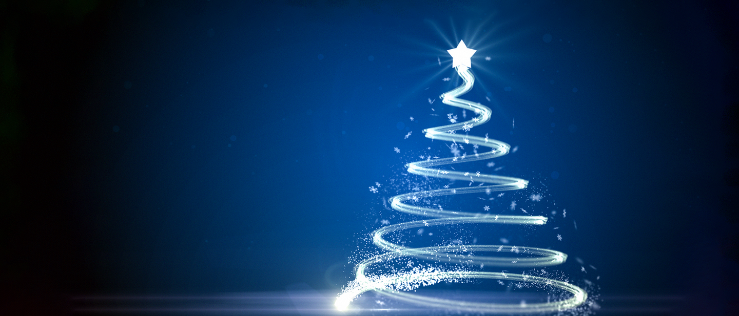 Glowing, spiral-shaped Christmas tree made of light trails with a bright star on top