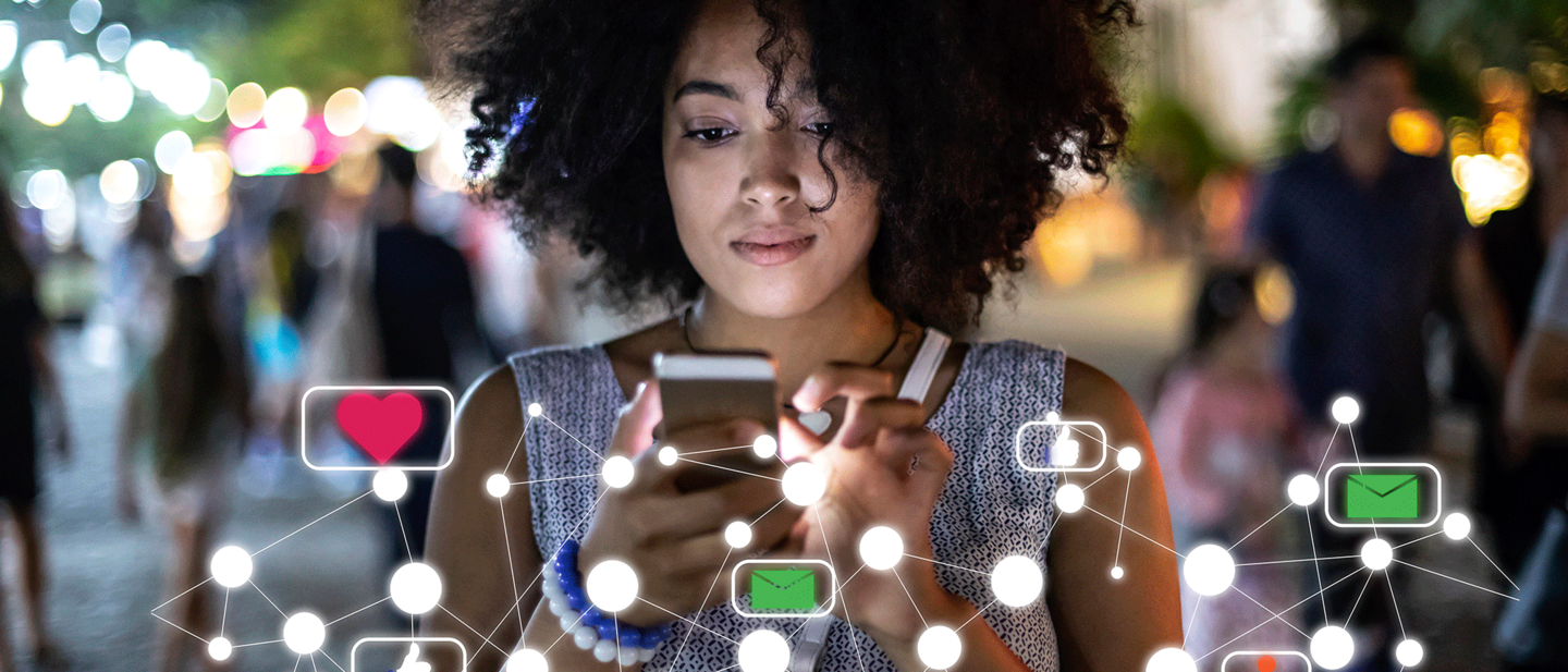 Businessman with smartphone and suitcase