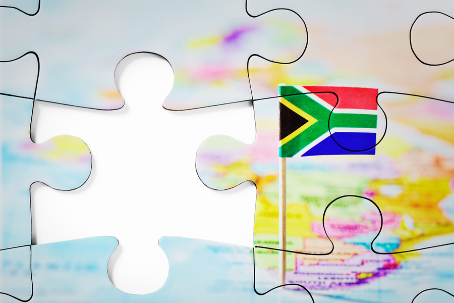 Shows missing puzzle piece of a puzzle of a world map with South Africa in focus