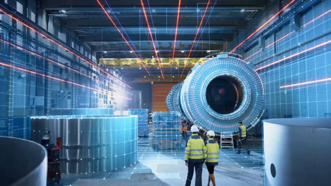 Various people wearing high-visibility vests and helmets walk through a factory hall