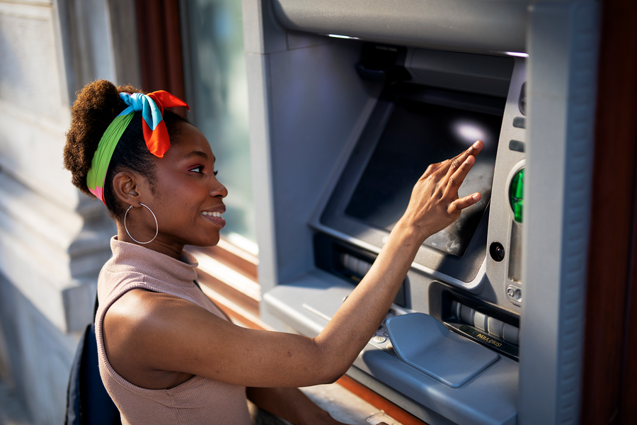 A woman using an ATM