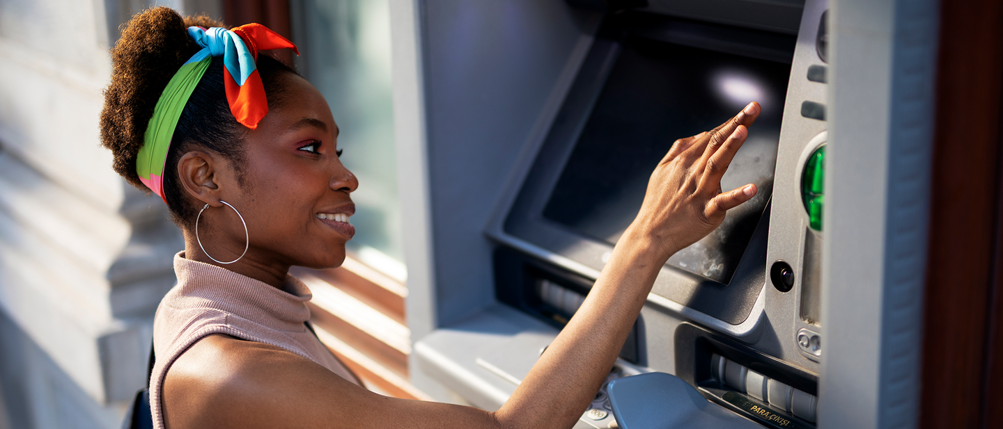 A woman using an ATM