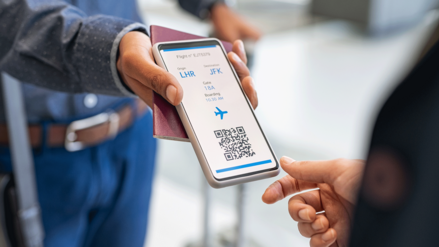 A man shows his board card on his smartphone