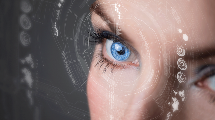 Close-up of an eye with digital structures circling in front of it