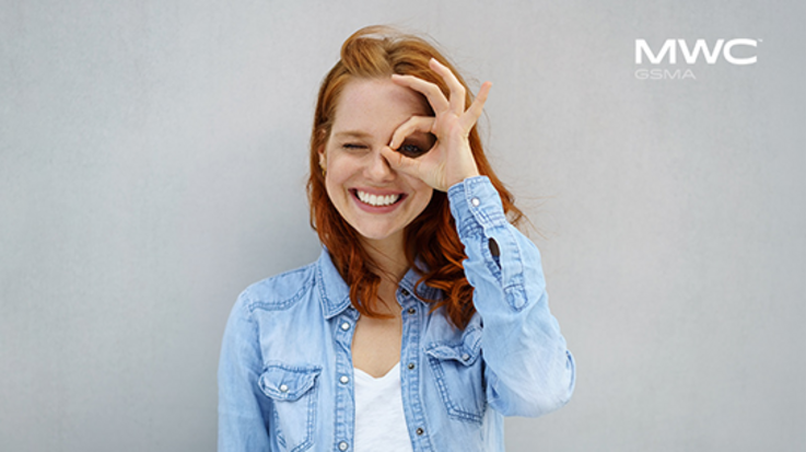 Woman looking through OK finger gesture