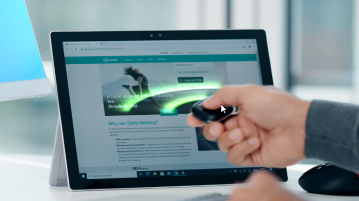 A man connects to his tablet contactlessly with a fob